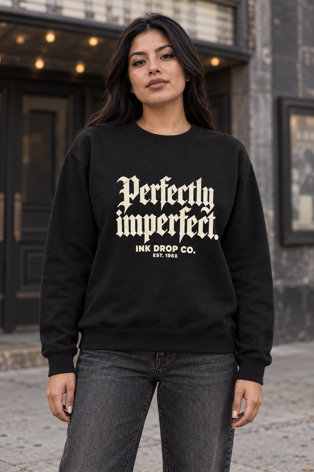 Black unisex crewneck sweatshirt with 'Perfectly imperfect' front graphic and small text