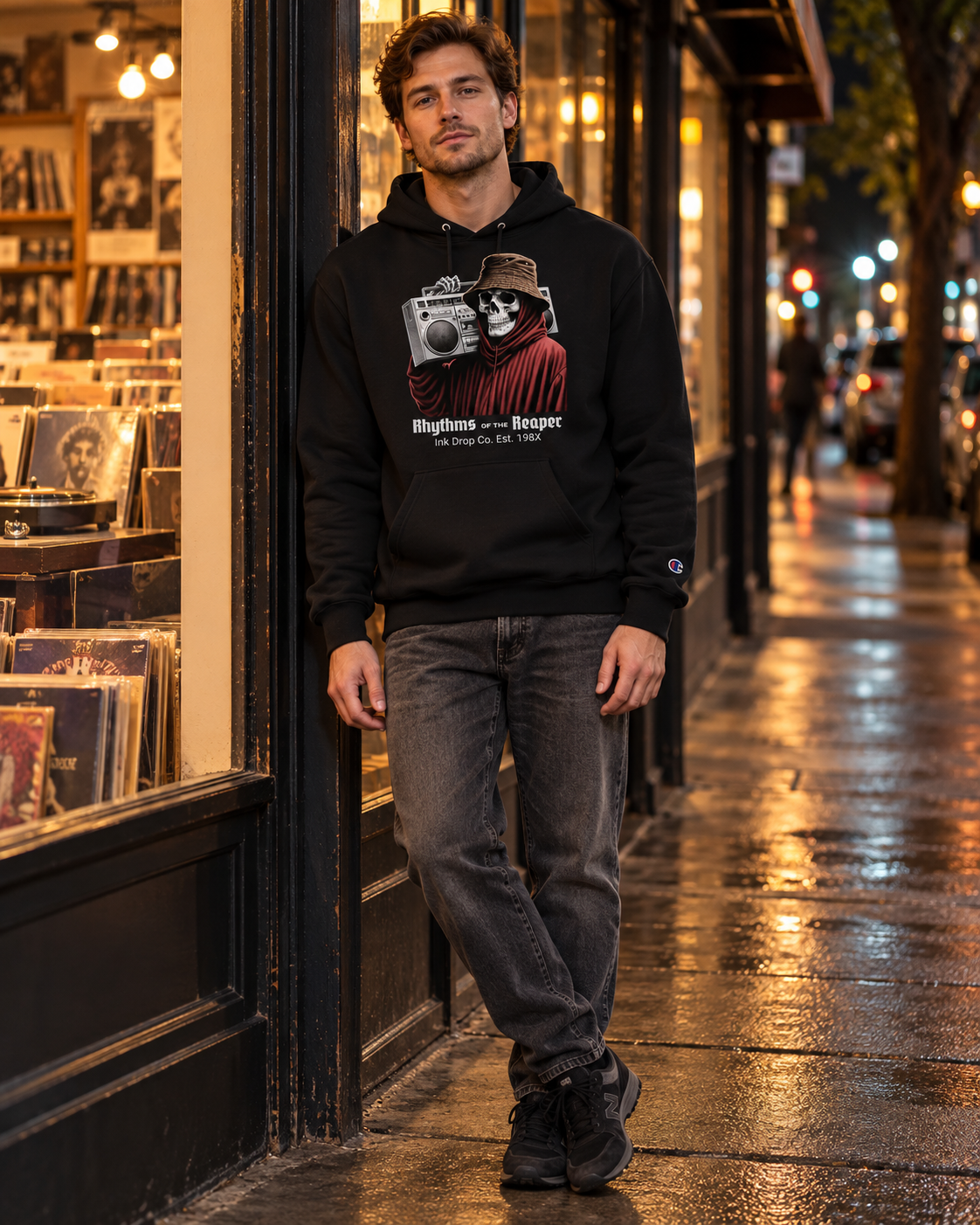 Unisex black pullover hoodie on model with front skull camcorder graphic
