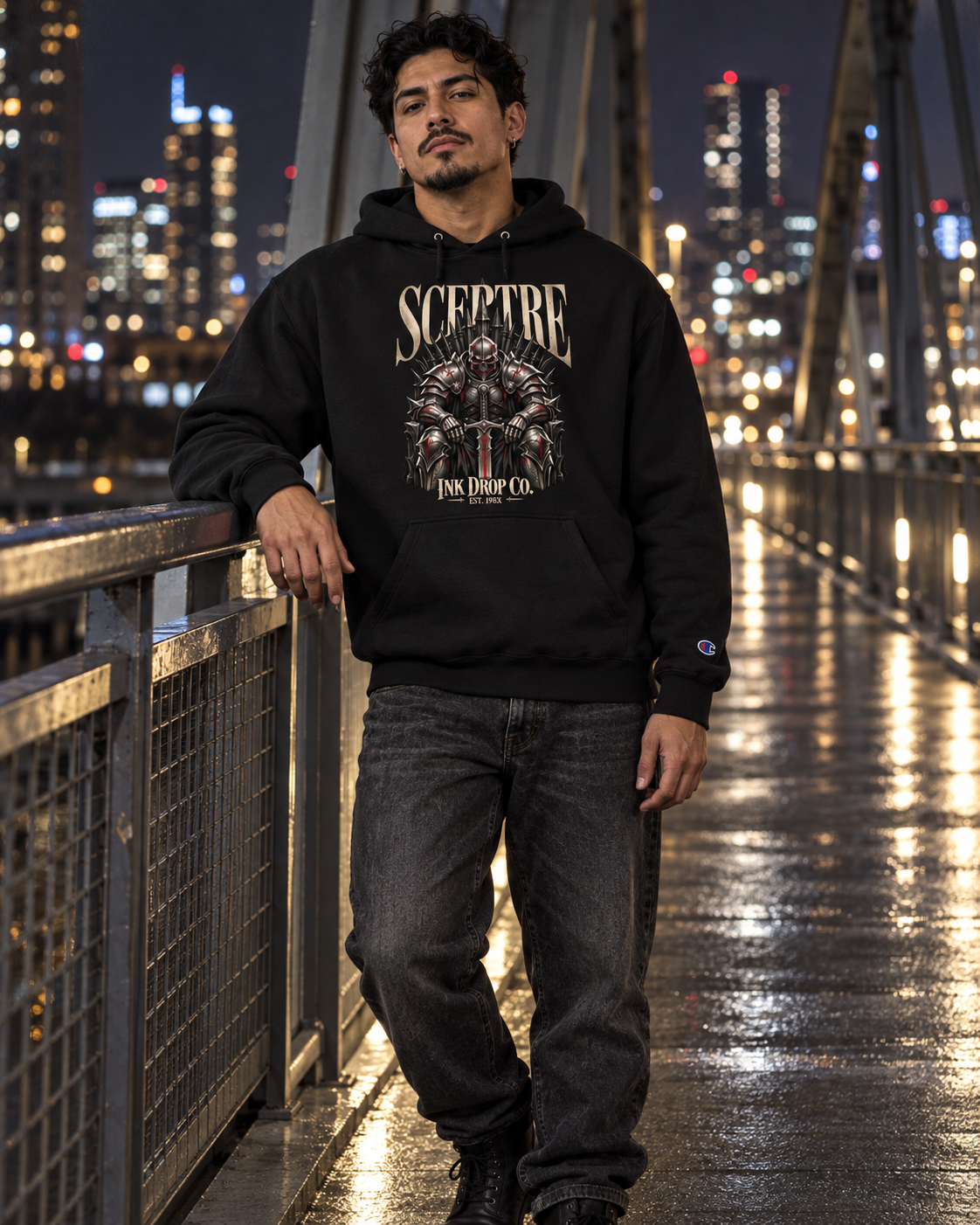 Unisex black hoodie with SCEPTRE chest graphic, hood and drawstrings, worn by model