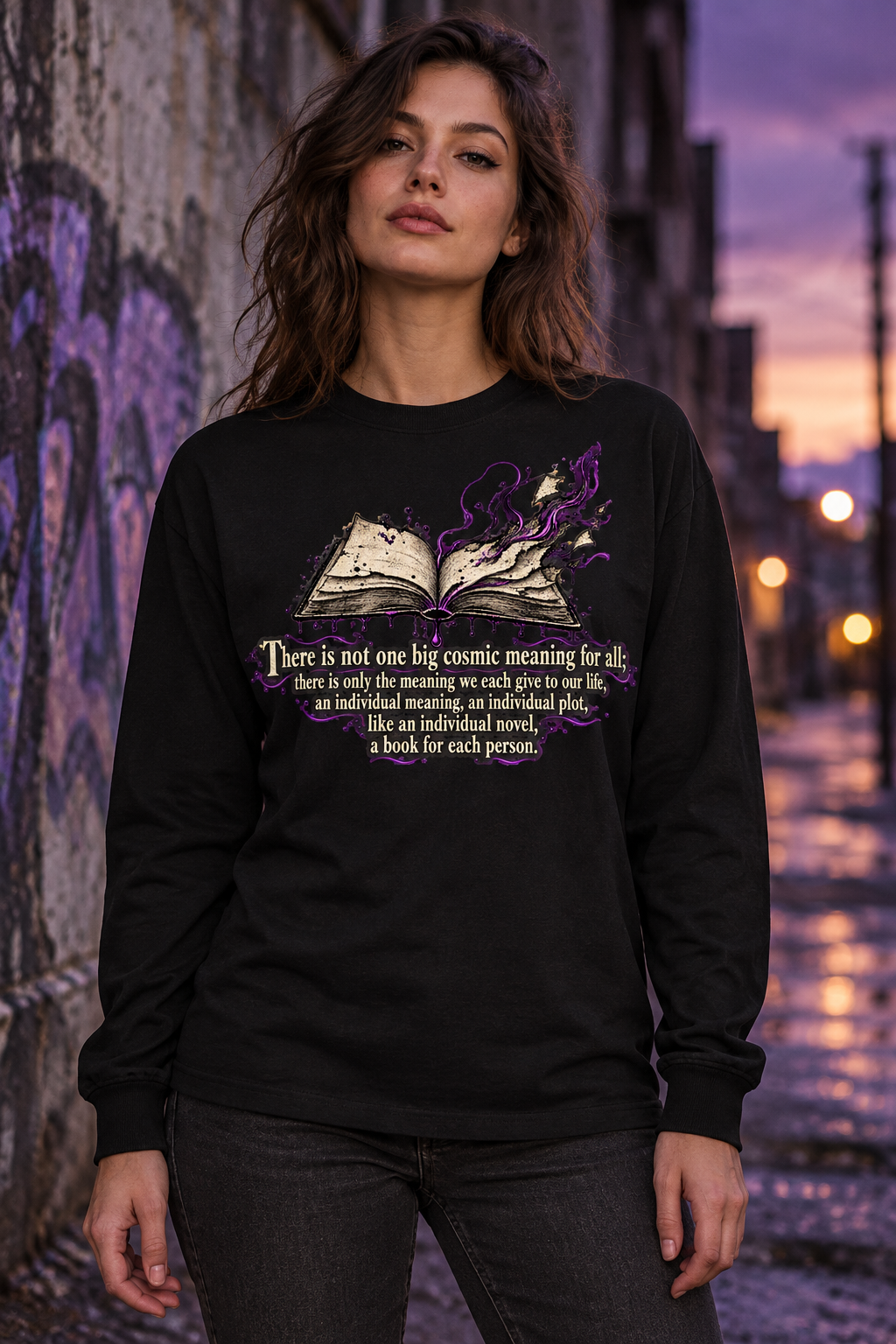 Unisex black long-sleeve crewneck graphic tee on model, front purple-and-white quote artwork