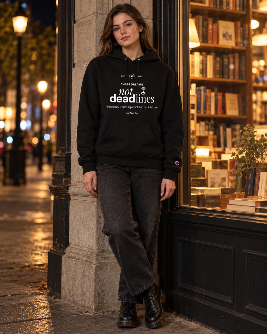 Black unisex pullover hoodie with front 'not deadlines' graphic and drawstring hood