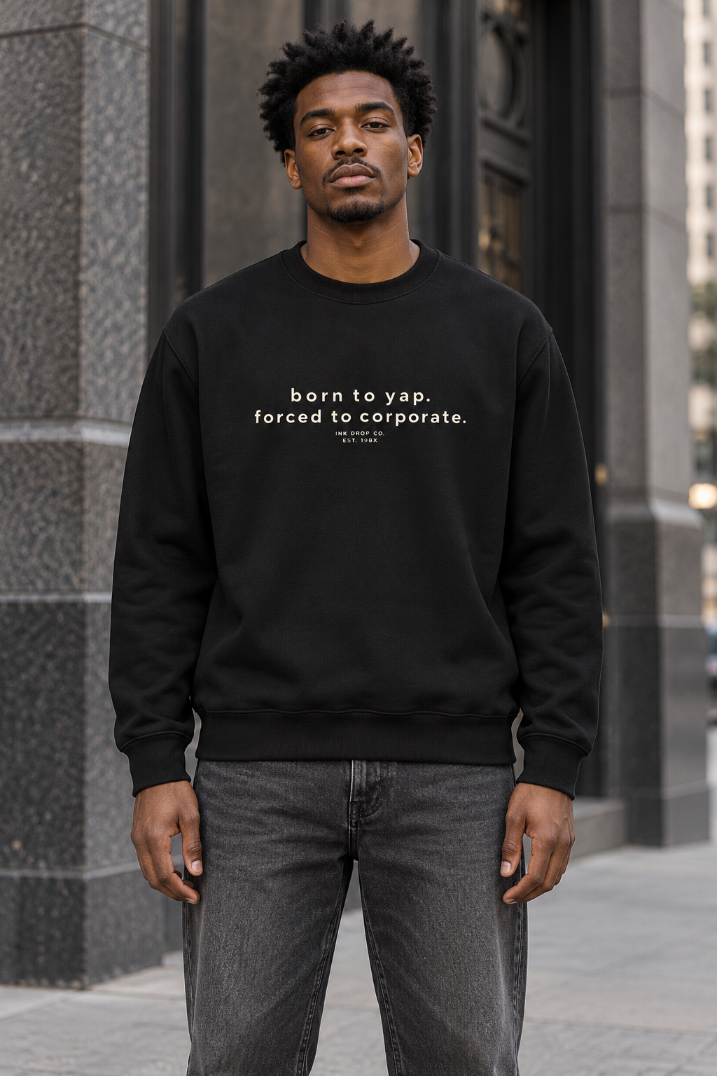 Unisex crewneck sweatshirt in black, worn front with small text graphic