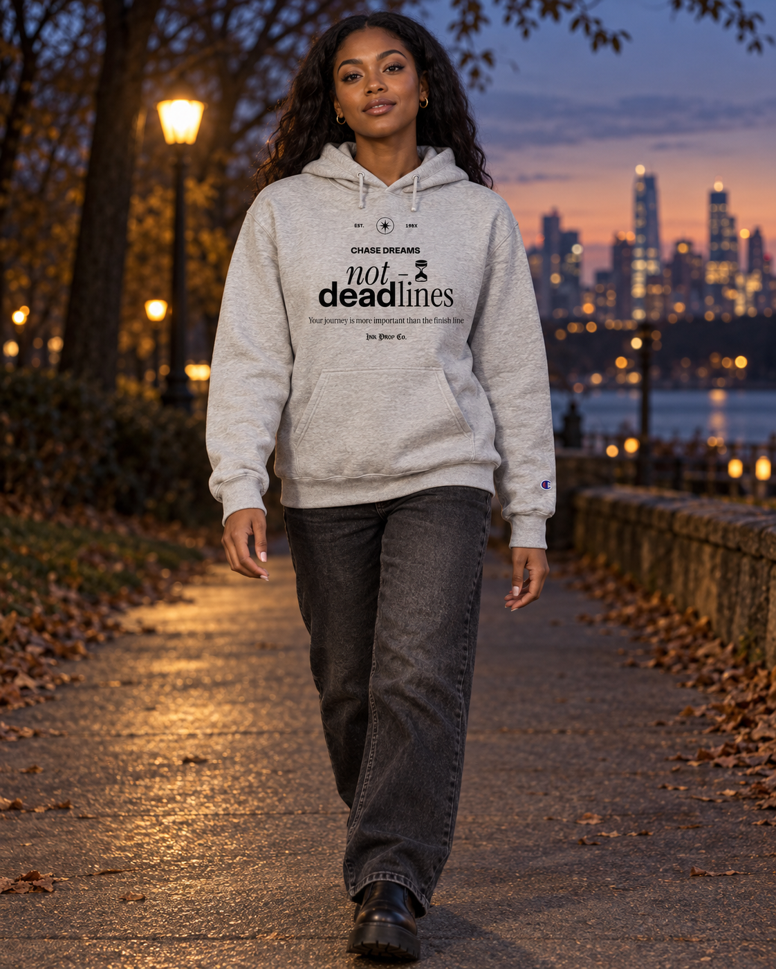 Gray Champion hoodie with 'not deadlines' chest text, hood drawstrings, and kangaroo pocket