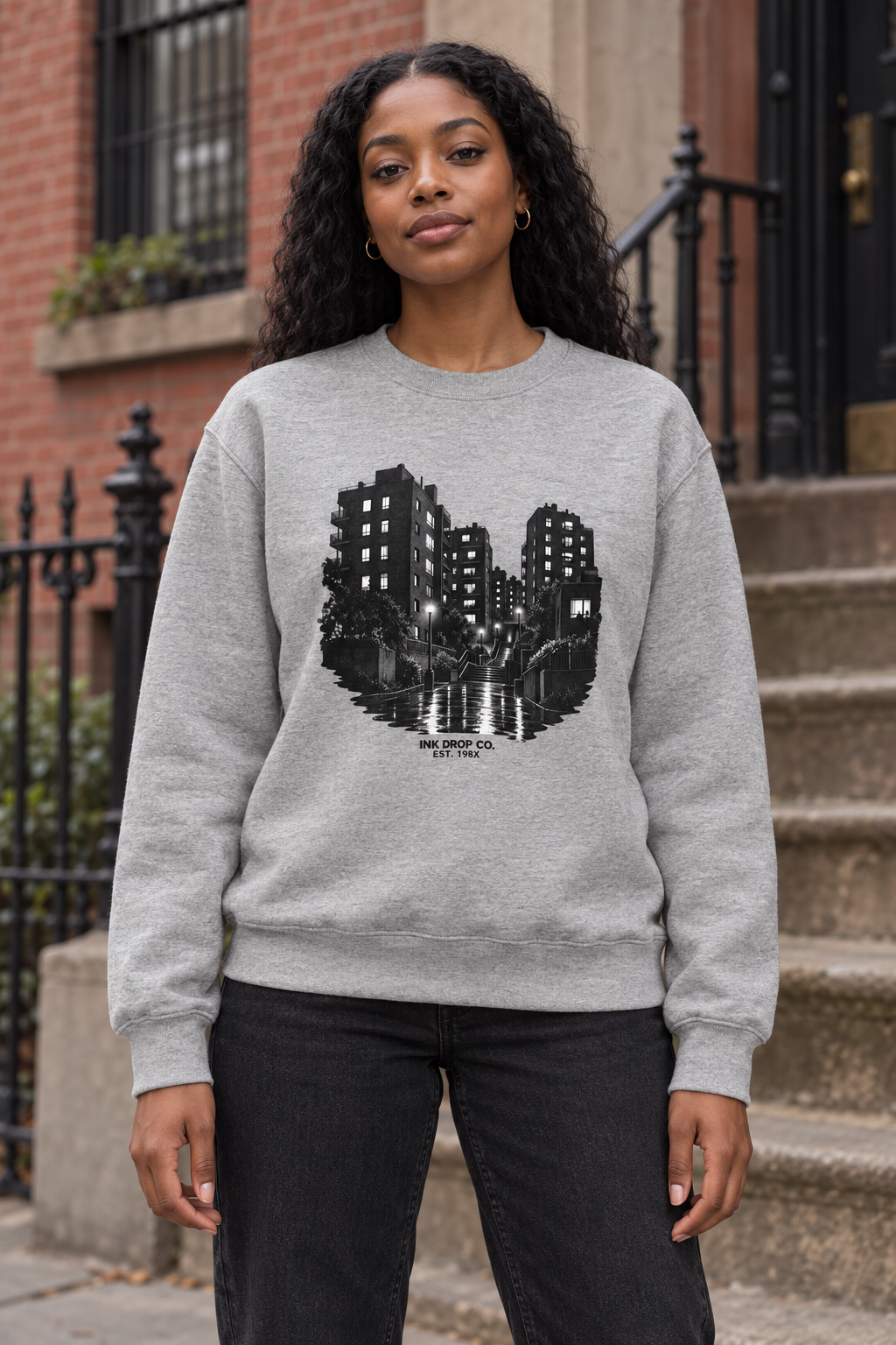 Heather grey unisex crewneck sweatshirt with black city skyline graphic on front