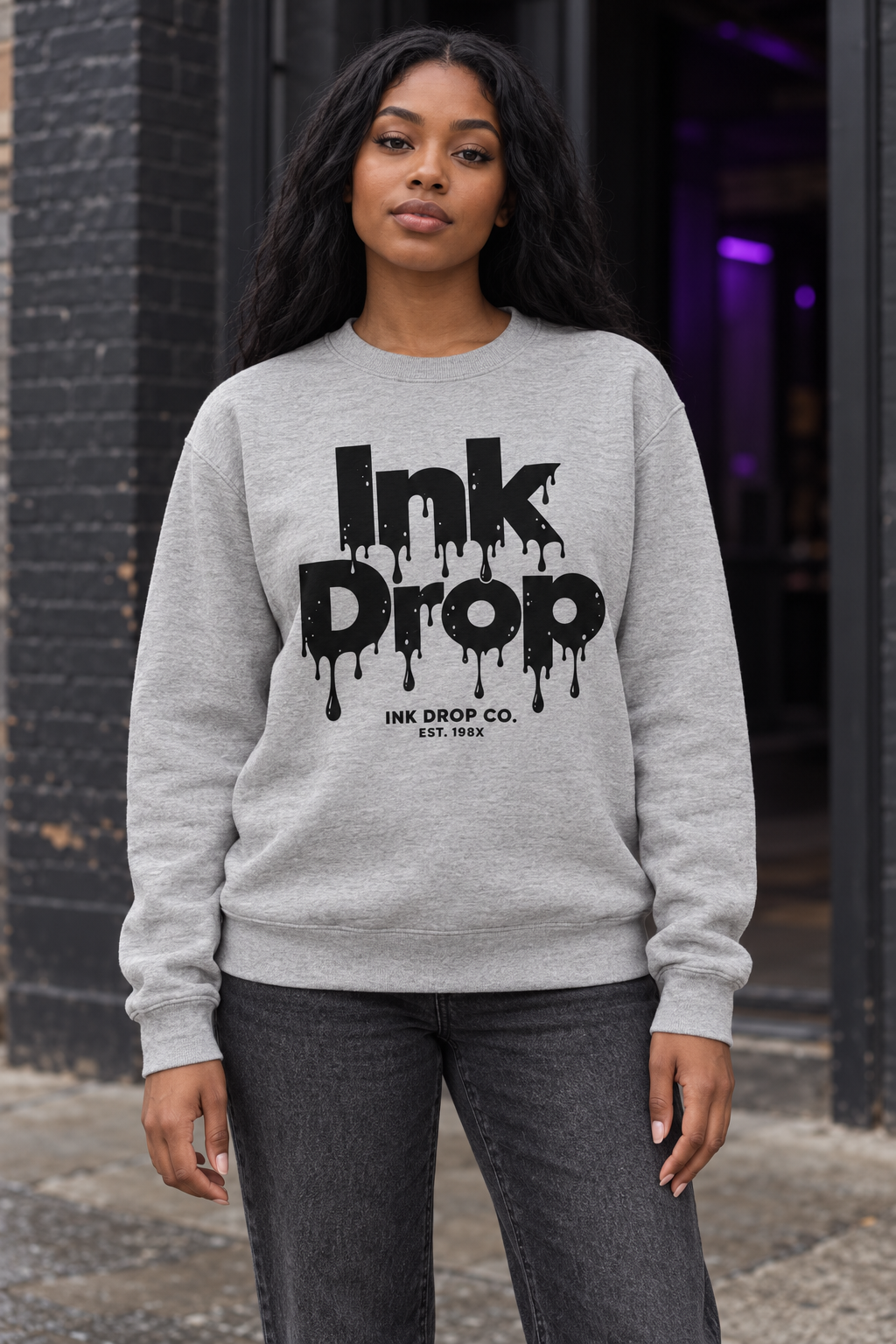 Heather gray crewneck sweatshirt featuring Ink Drop logo print on front