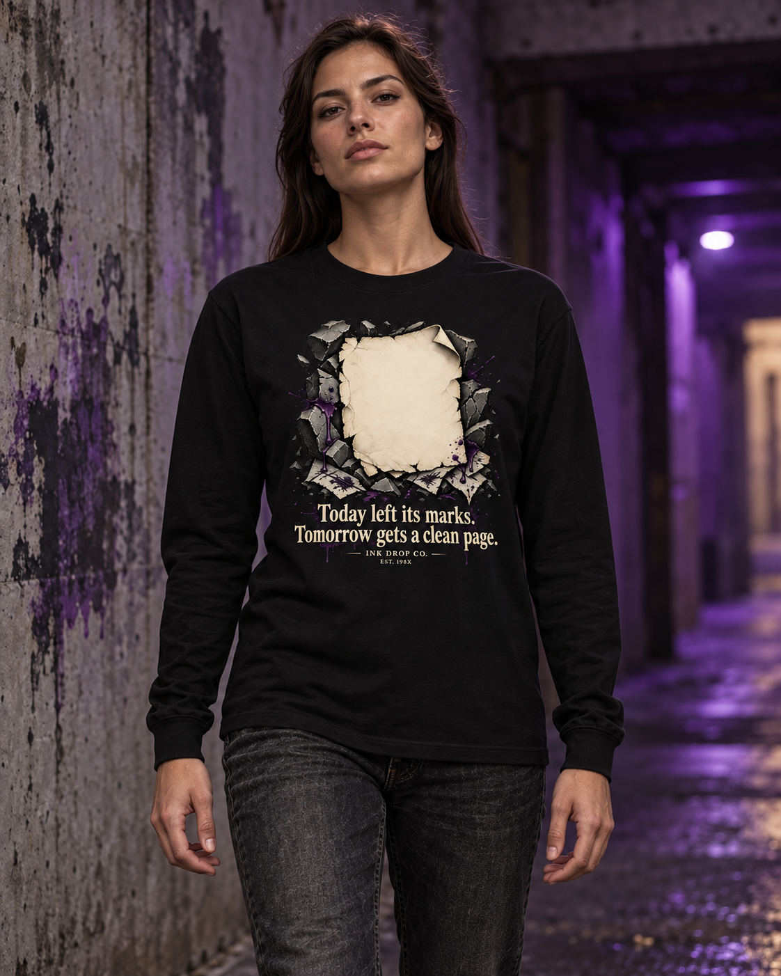Unisex black long sleeve graphic tee on model with distressed square chest print