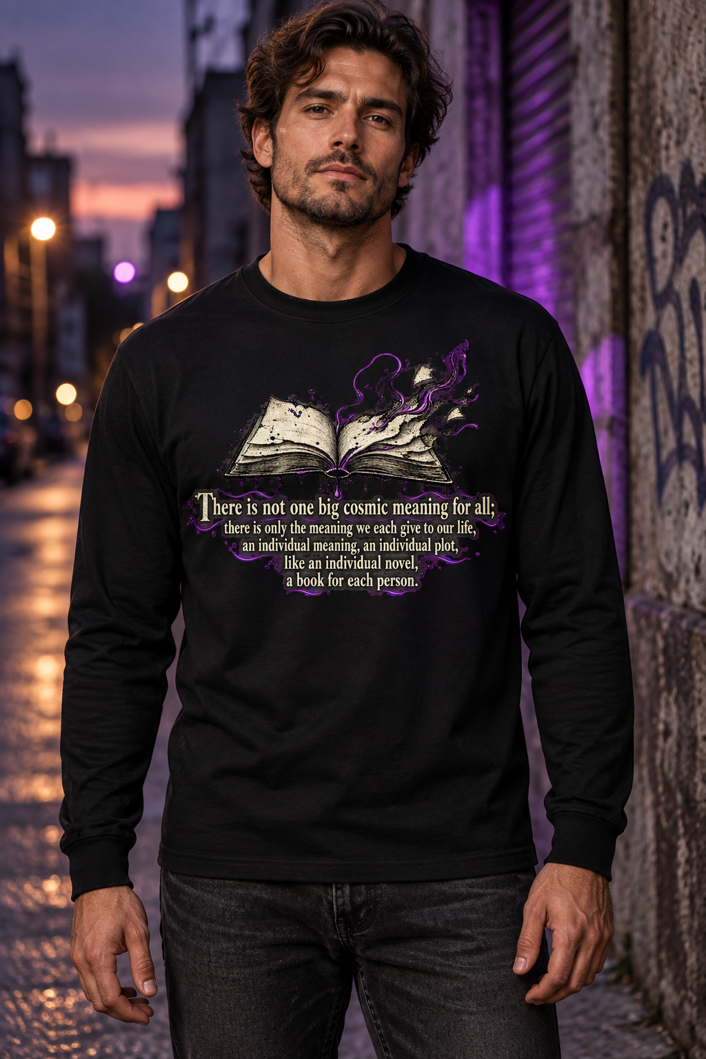 Unisex black long-sleeve crewneck graphic tee on model, front purple-and-white quote artwork