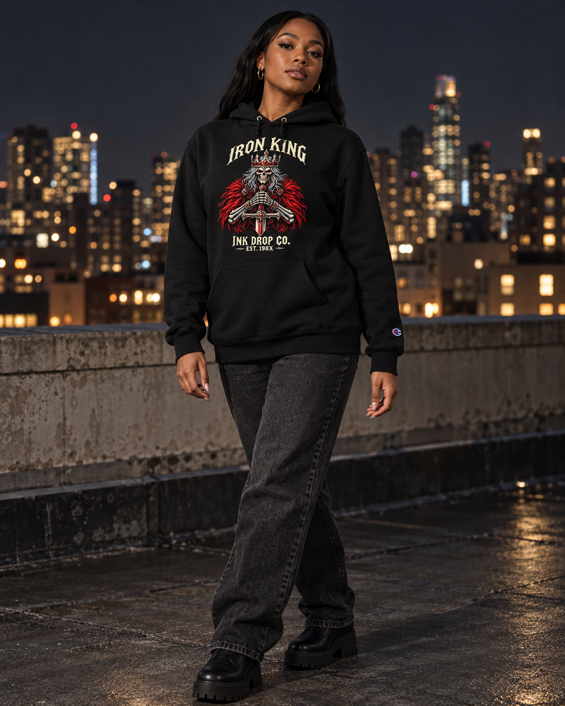 Unisex black graphic hoodie worn with jeans, front Iron King chest print