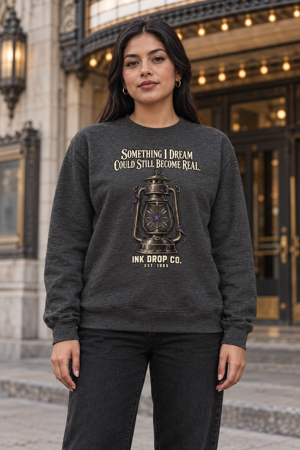 Charcoal unisex crewneck sweatshirt with gold lantern graphic on chest.