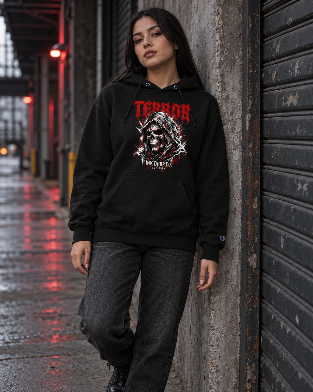 Black unisex hoodie with front skull graphic and hood with drawstrings