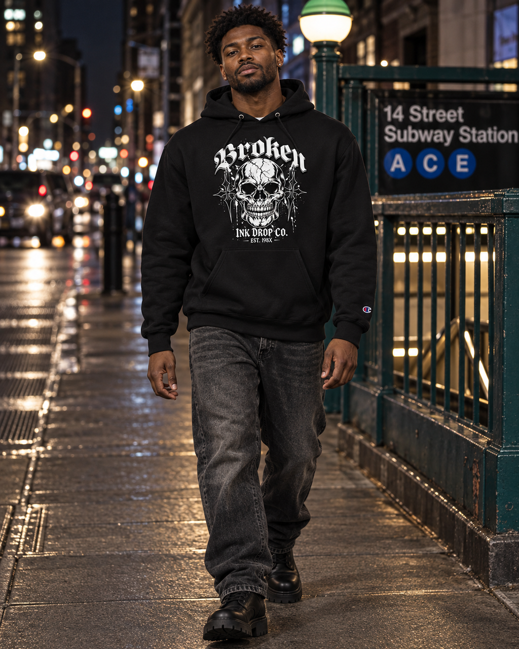 Black unisex hoodie worn outdoors, front skull graphic with hood and kangaroo pocket