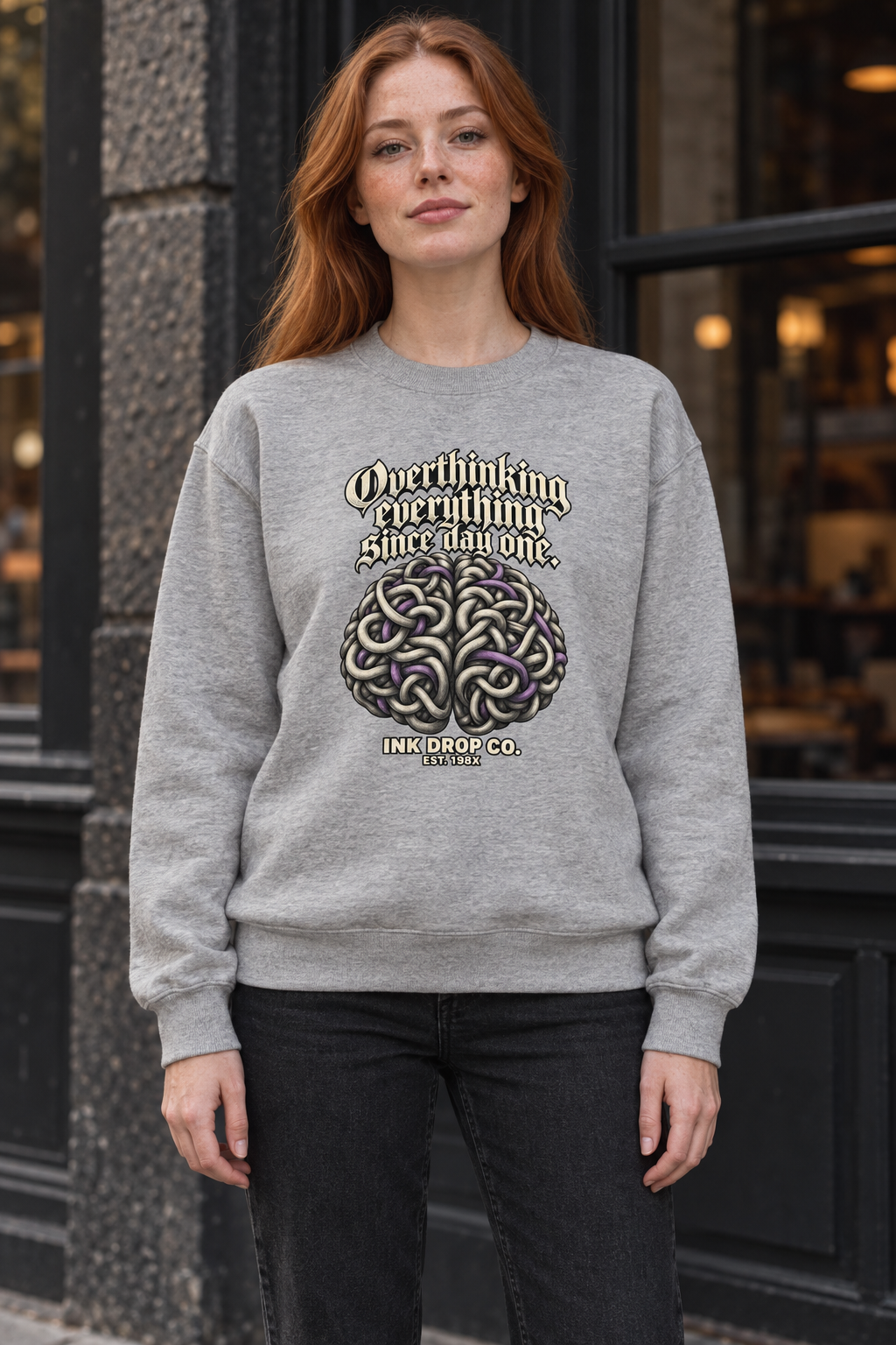 Heather grey unisex crewneck sweatshirt worn by model with front chest graphic print