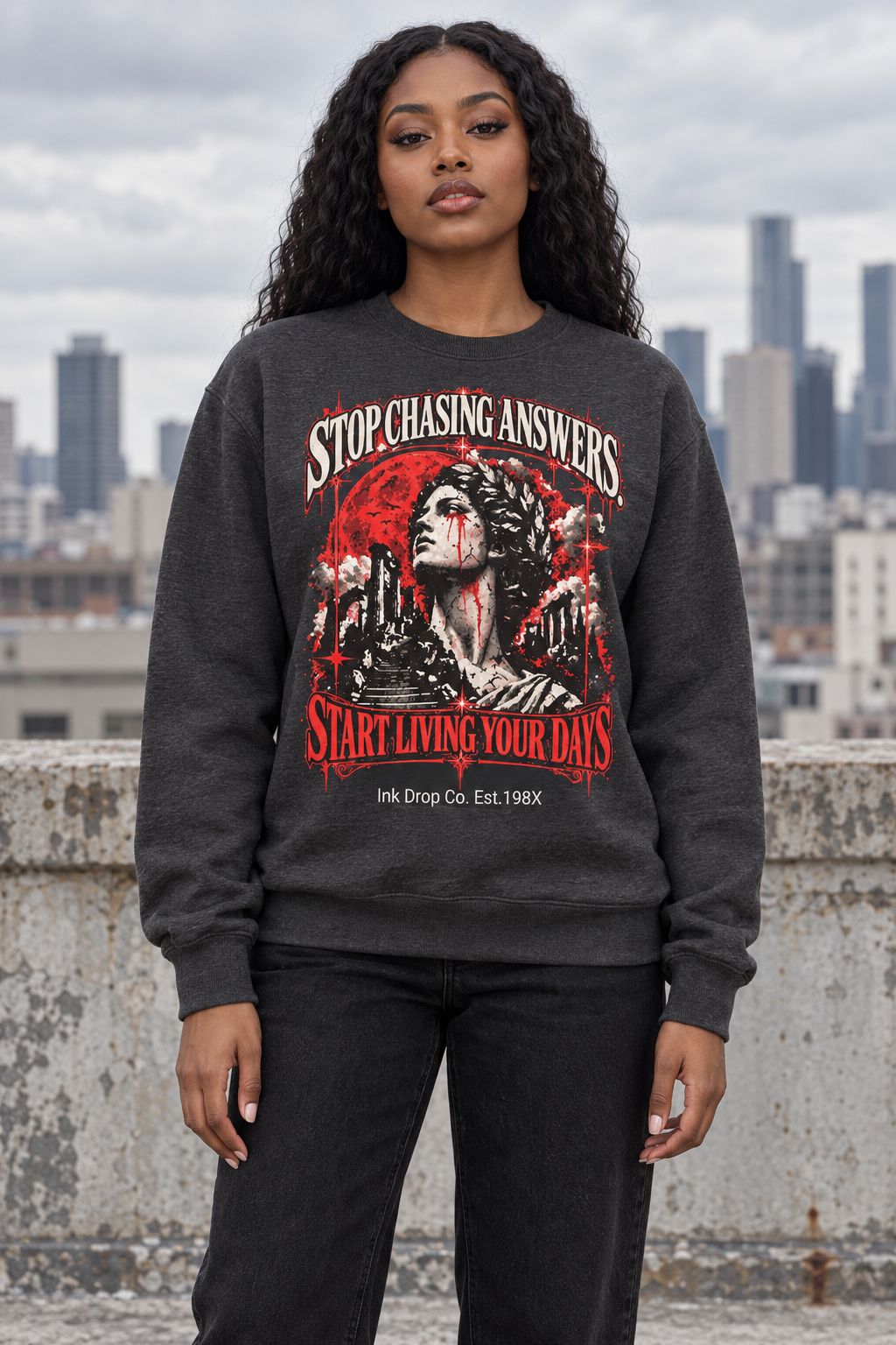 Dark heather gray crewneck sweatshirt with large red-and-white face graphic on front