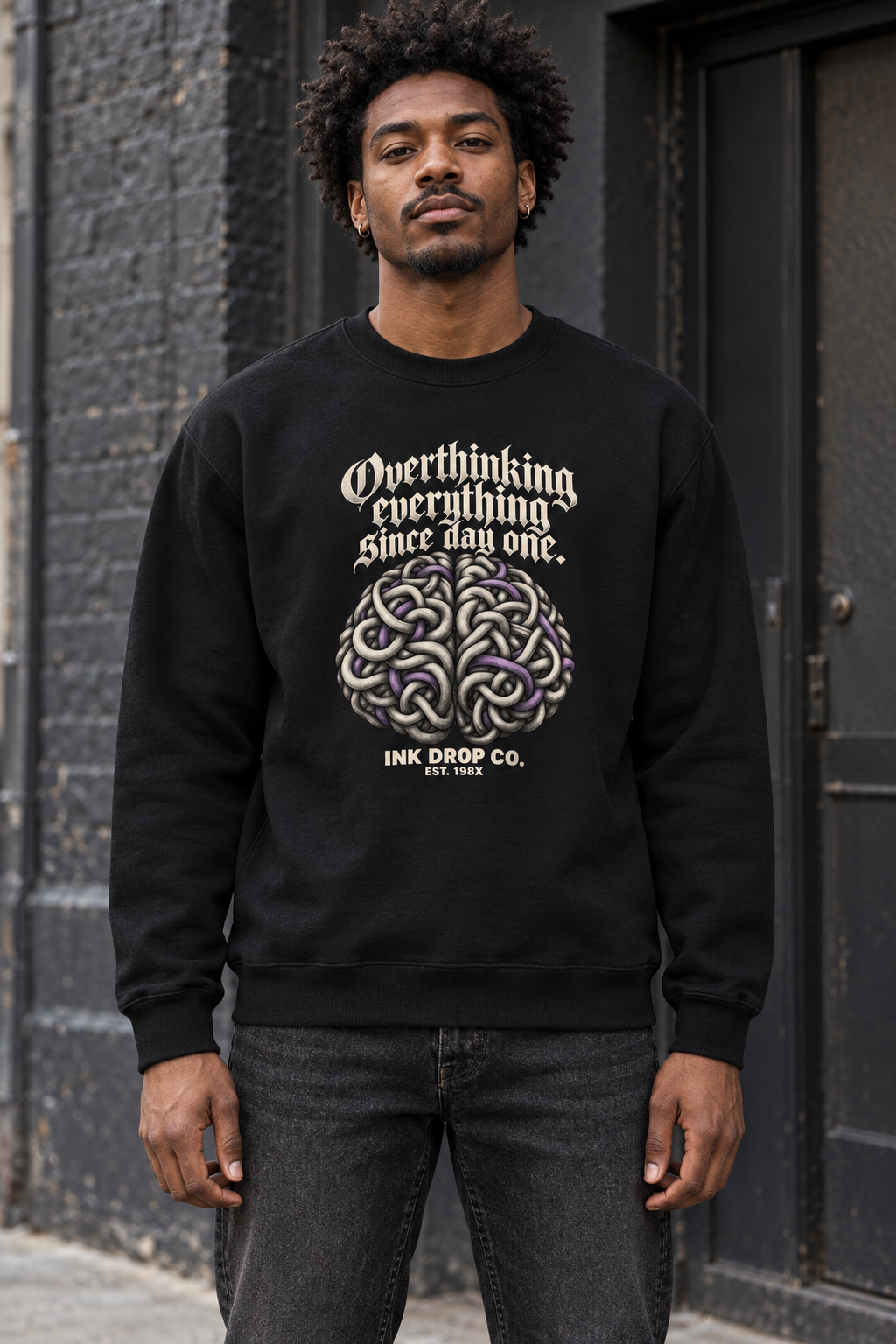 Black unisex crewneck sweatshirt with front graphic and ribbed cuffs