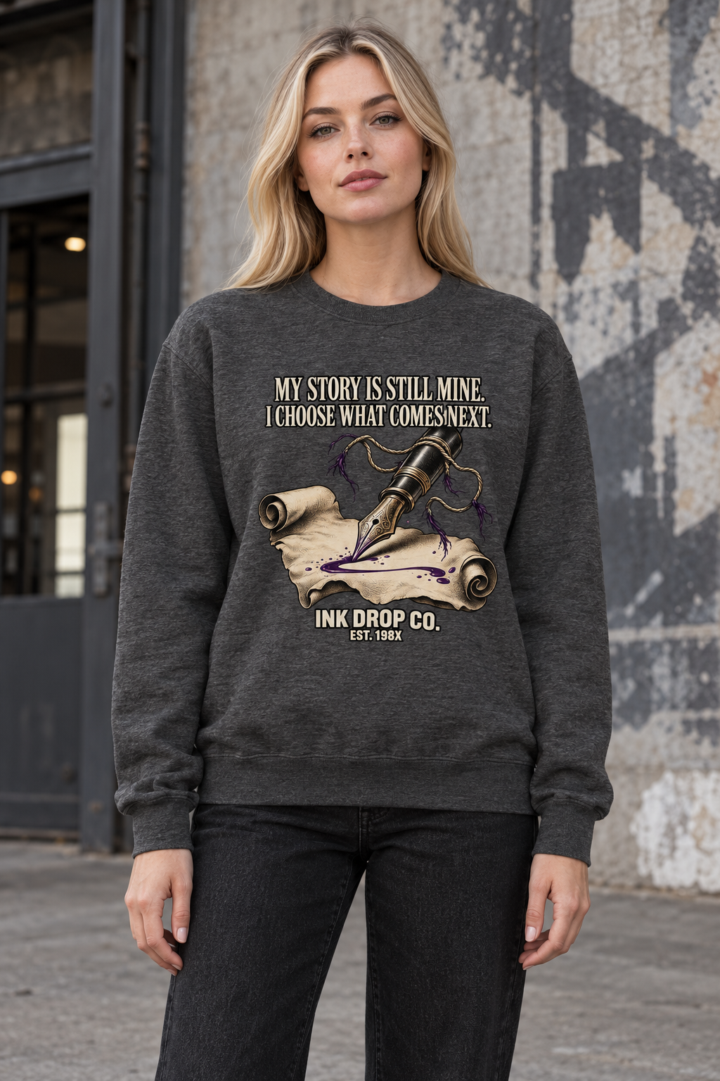 Charcoal heather unisex crewneck sweatshirt with front graphic and ribbed hem.