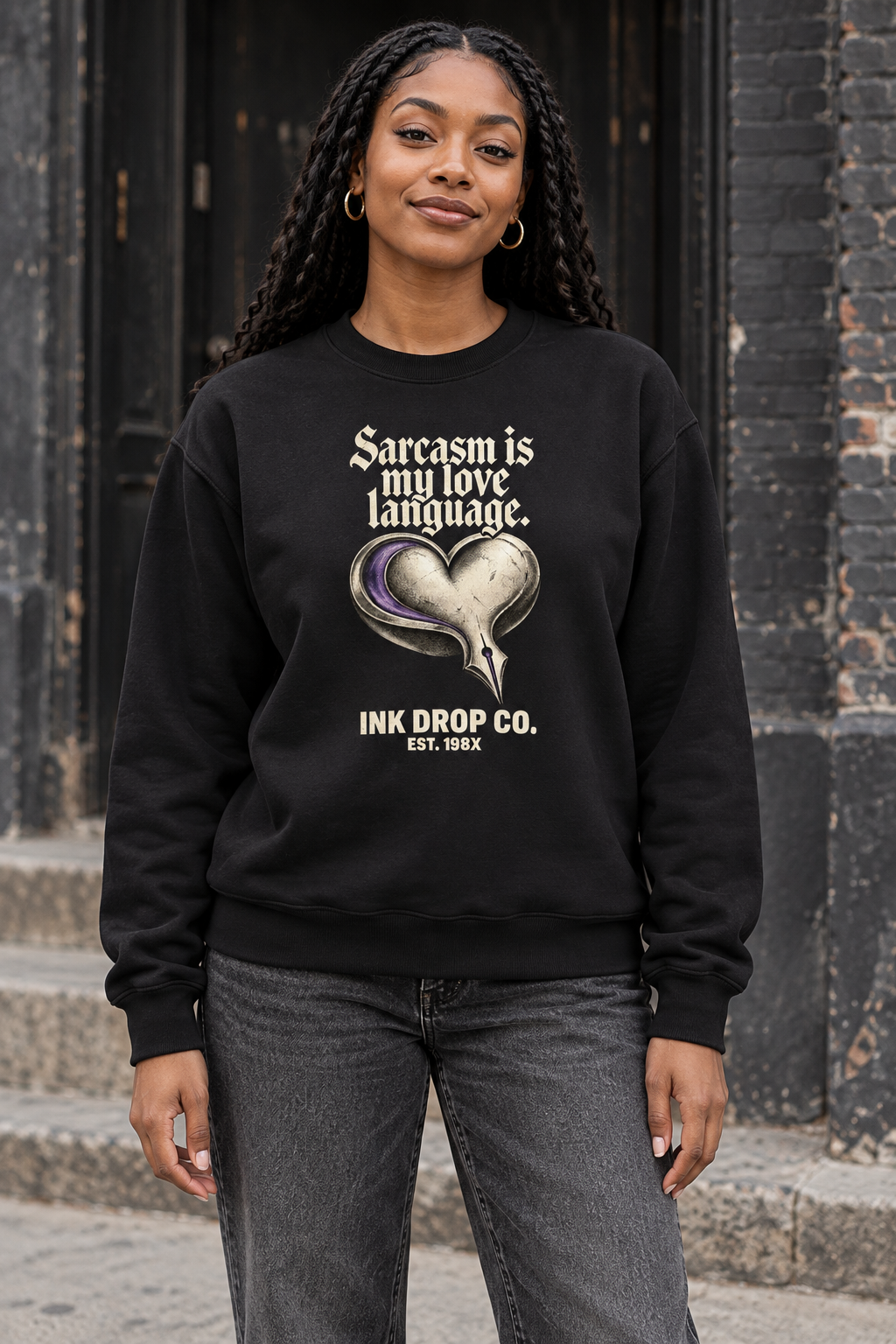 Black crewneck sweatshirt with heart graphic and slogan text on front
