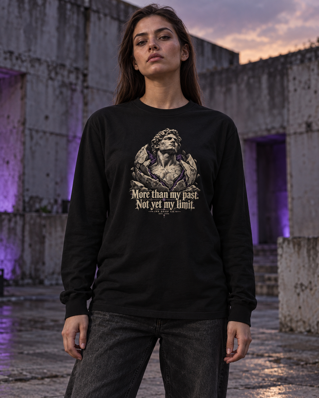 Black unisex long sleeve tee on model, centered front graphic and quote