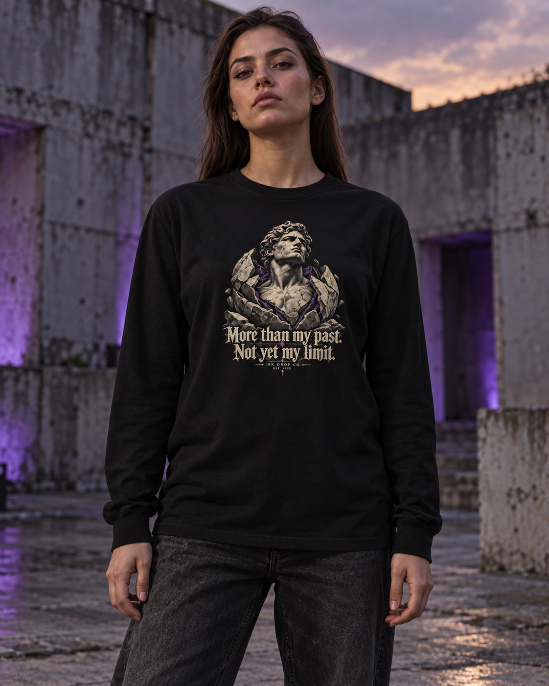 Black unisex long sleeve tee on model, centered front graphic and quote