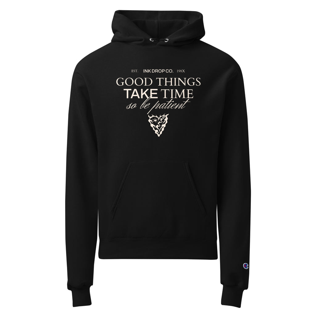 Black unisex pullover hoodie with "Good Things Take Time" chest graphic and pouch pocket