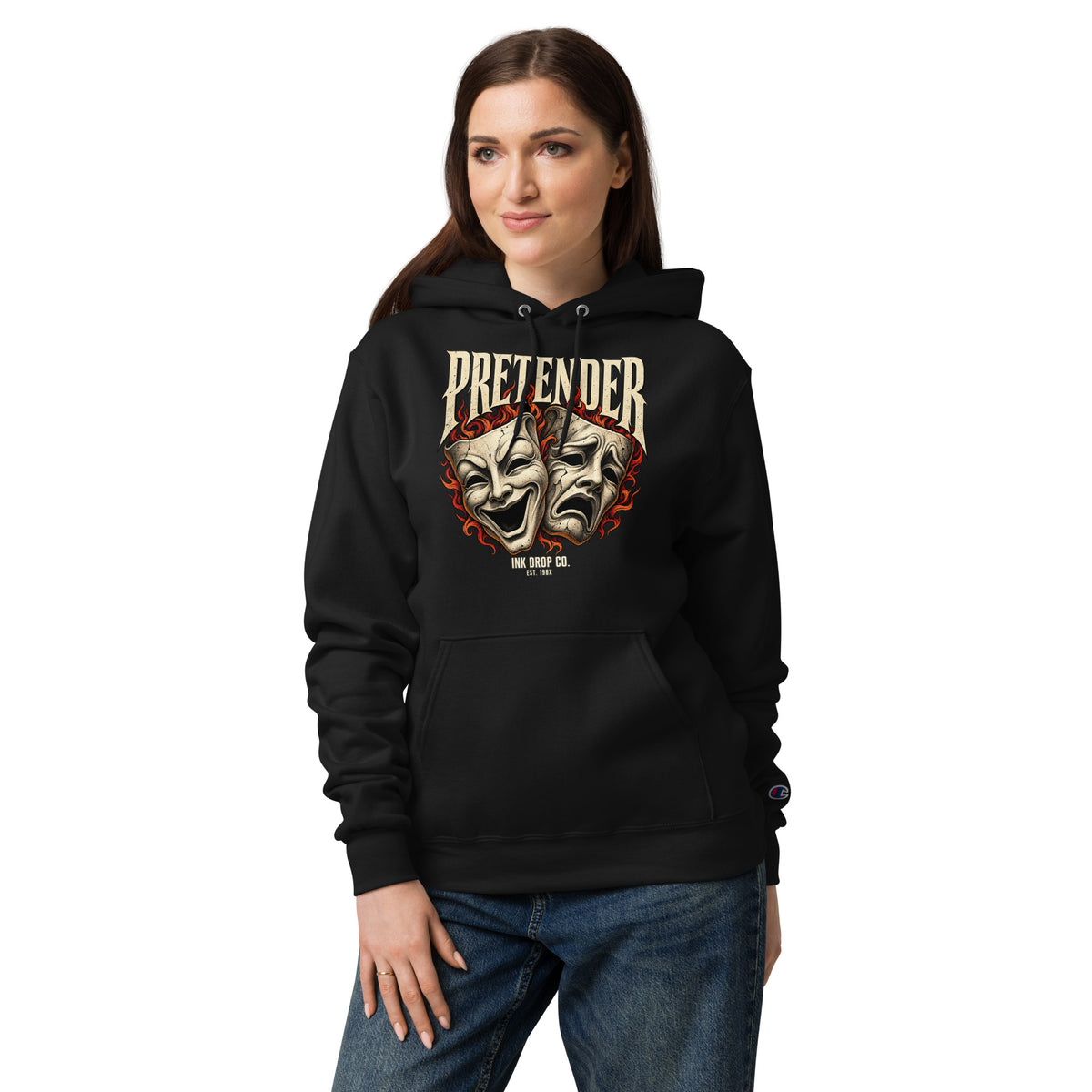Black Champion hoodie with a theater mask graphic, modeled from the front