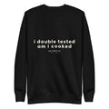 Black crewneck sweatshirt with chest graphic, long sleeves, ribbed cuffs and hem