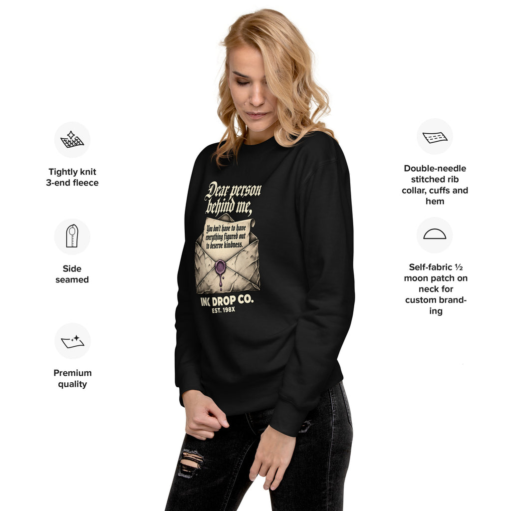 Black unisex crewneck sweatshirt front view with graphic print on chest