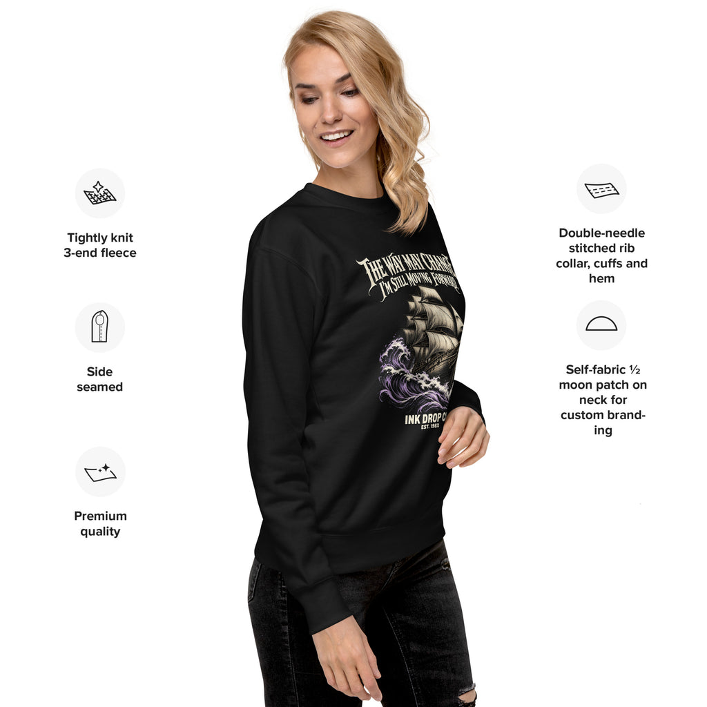 Unisex crewneck sweatshirt, black, side view on model with sleeve graphic and rib cuffs.