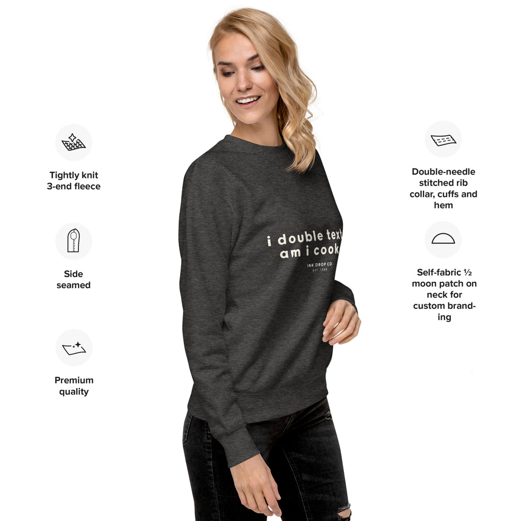 Dark grey crewneck sweatshirt on model, front view with ribbed cuffs and hem