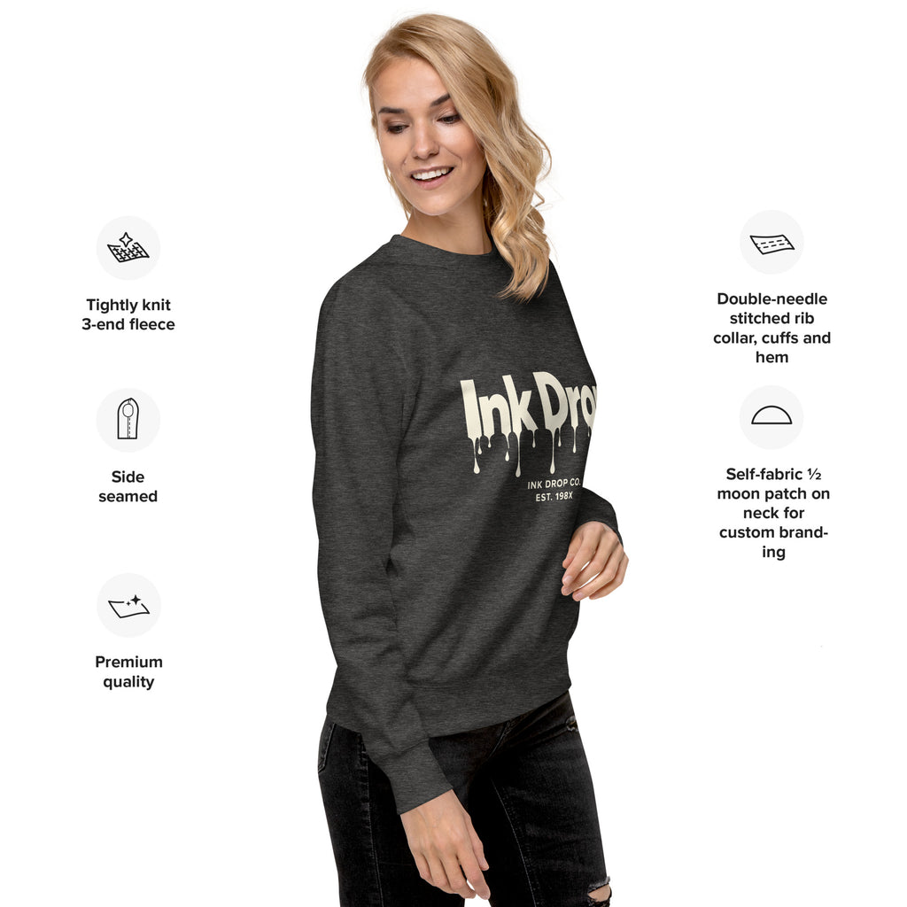 Charcoal heather unisex crewneck sweatshirt with partial Ink Drop drip logo on front