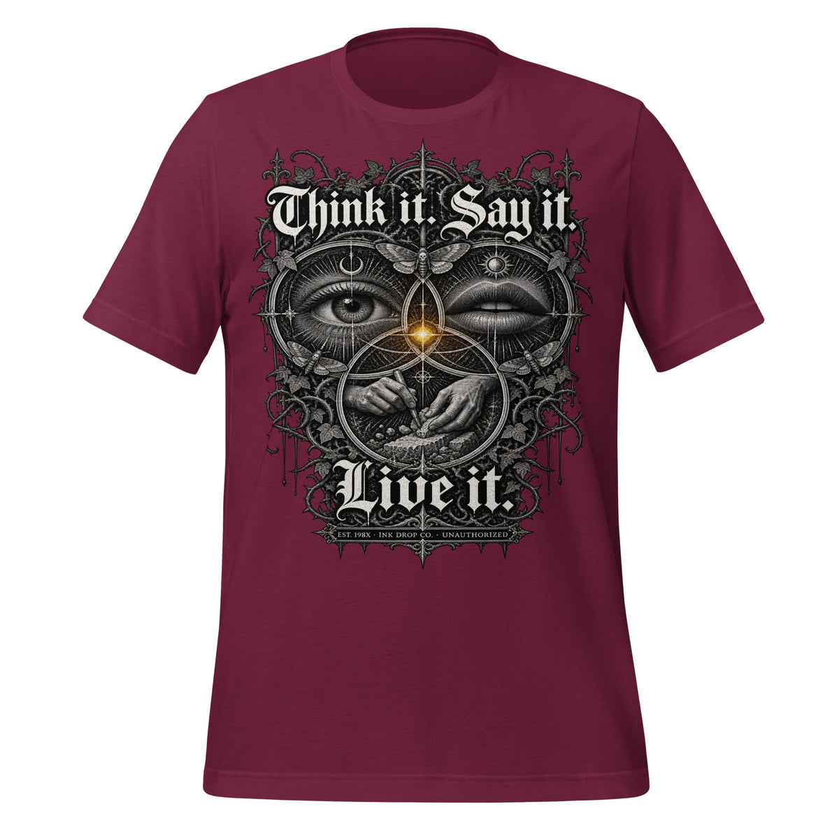 Maroon unisex graphic tee with 'Think it Say it Live it' face-eye graphic on front