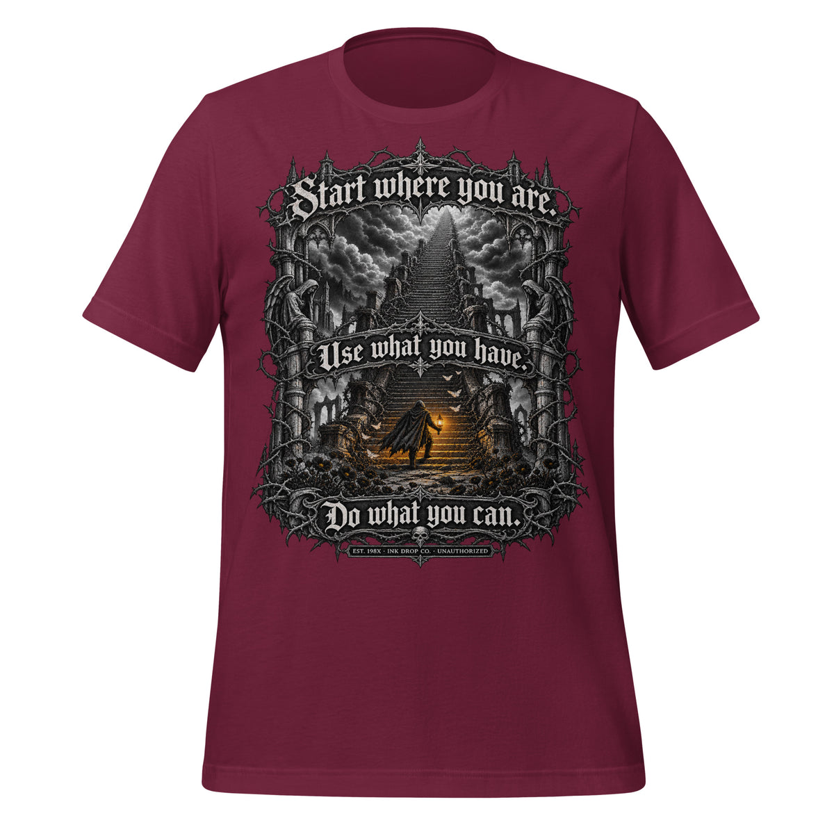 Maroon unisex graphic tee with centered fantasy artwork and text on front