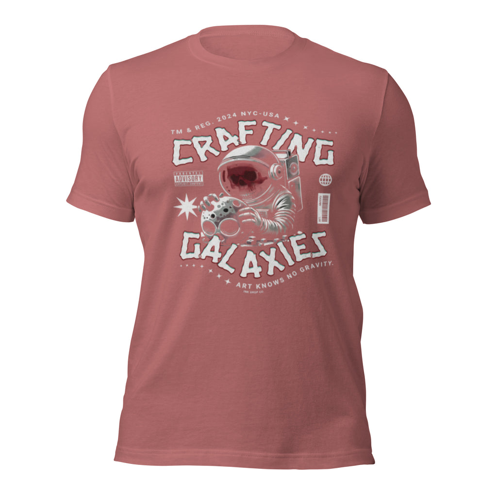 Mauve unisex graphic t-shirt with “Crafting Galaxies” astronaut print on the front.