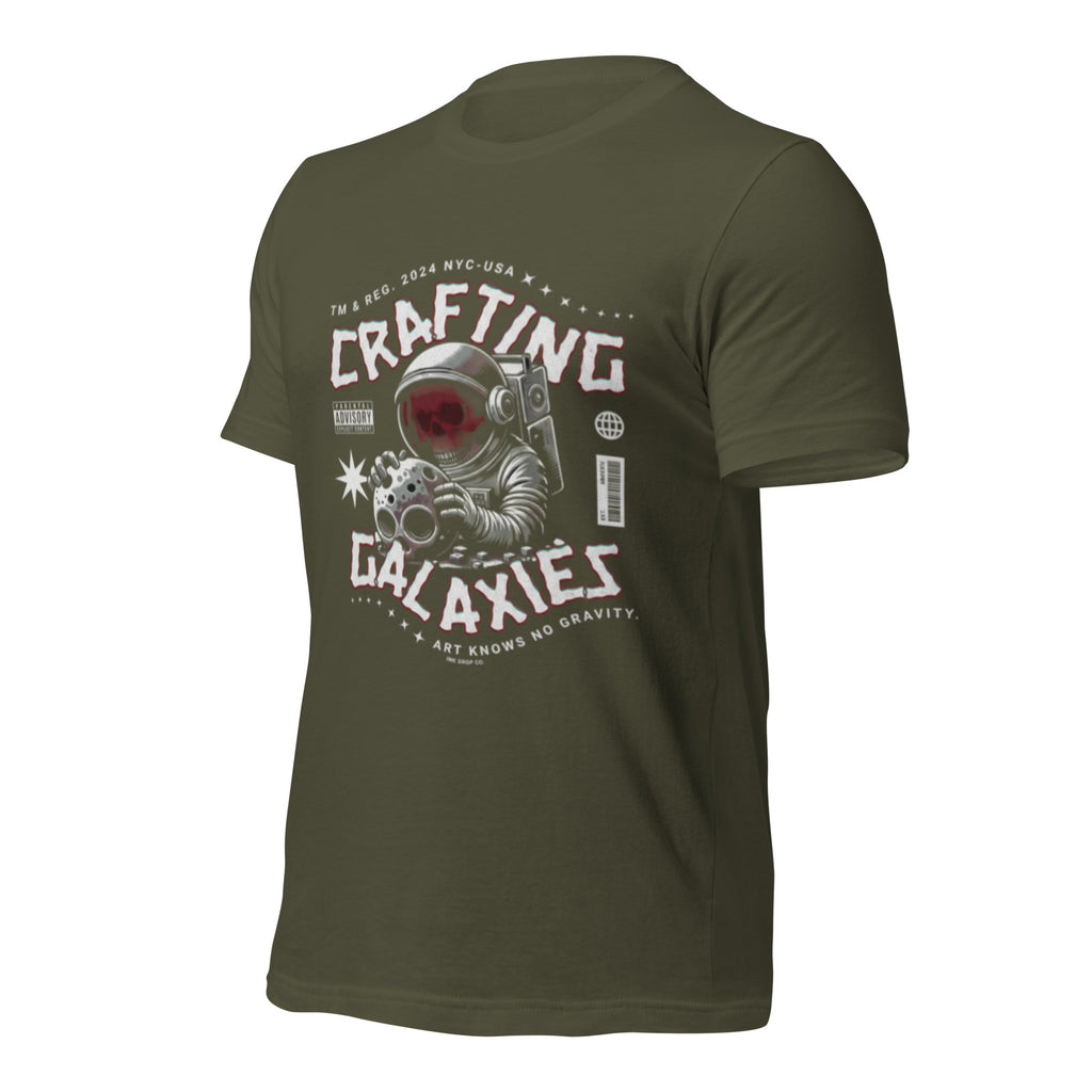 Military green unisex graphic t-shirt with “Crafting Galaxies” astronaut print on the front.